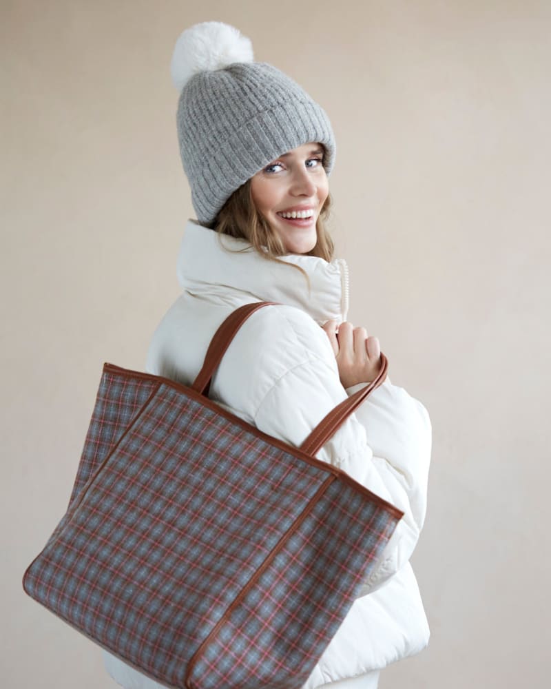Side of a model wearing a size One Size Pick-A-Pom Winter Knit Hat/Beanie in Grey by Shiraleah. | dia_product_style_image_id:308966